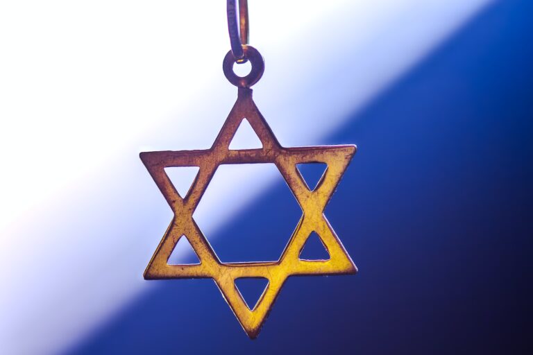 a star of david hanging from a chain